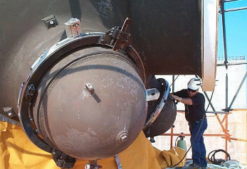 Outer diameter mounted pipe lathe shown installed on a replacement steam generator for severance cutting of the hydrostatic test cover